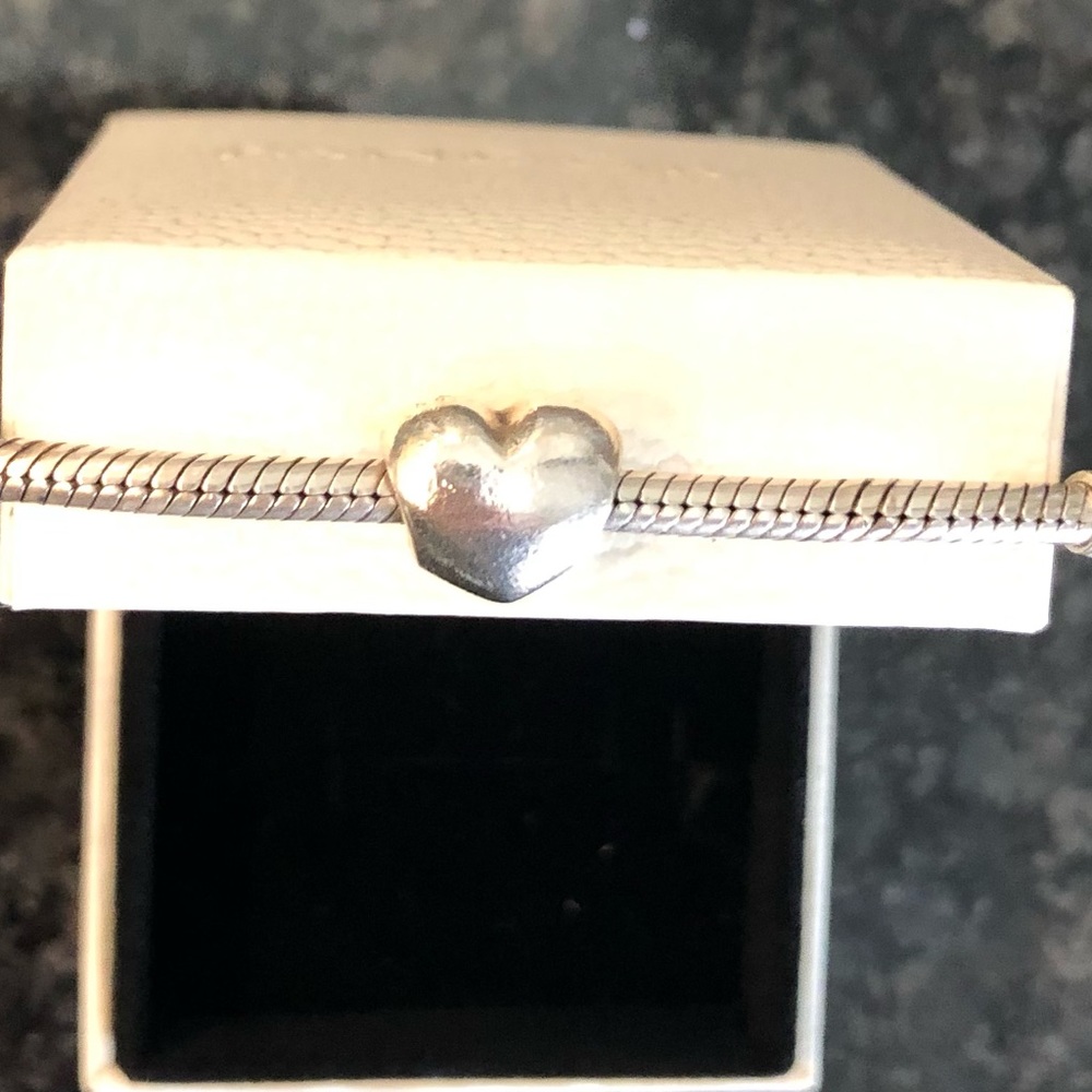 Pandora sterling silver snake bracelet with retired solid silver heart.